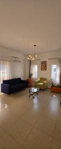 a living room with a couch and a coffee table at Modern Secured Condo Apartments 1 in Tema