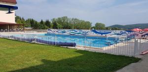 a large swimming pool with a fence around it at Morski Duni in Shkorpilovtsi