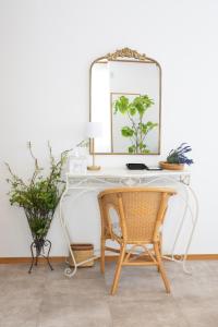 a white desk with a mirror and a chair at ラベンダー富士 富士山と過ごすおしゃれな隠れ家 in Fuji