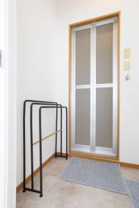 a sliding glass door with a mat in front of it at ラベンダー富士 富士山と過ごすおしゃれな隠れ家 in Fuji +36 photos