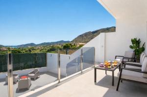 a balcony with a view of the mountains at Mountain Villa with Pool by NRAS in Orcheta +37 photos