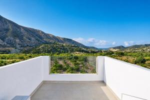 a room with a view of the mountains at Mountain Villa with Pool by NRAS in Orcheta