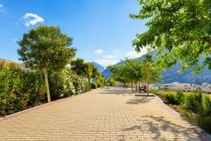 a cobblestone street with a bench and trees at Mountain Villa with Pool by NRAS in Orcheta