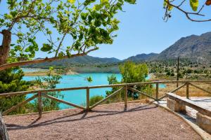 a view of a lake with mountains in the background at Mountain Villa with Pool by NRAS in Orcheta