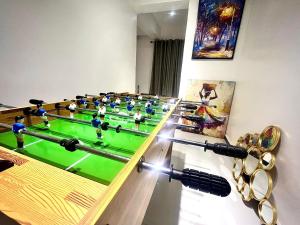 a room with a foosball table and a bunch of balls at VeraVistaStays in Odo