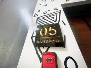 a clock with the number on a wall at VeraVistaStays in Odo +4 photos