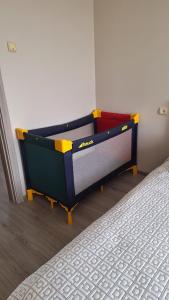 two beds are in a room with at Viktorija Apartament in Liepāja