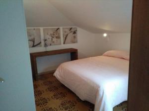A bed or beds in a room at Un Nido Sul Mare