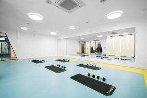 a room with a dance floor with black mats at Status-M Apartments 176 in Bečići