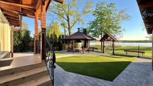 a pavilion with a gazebo and a bench at TJ Nyaraló in Markaz