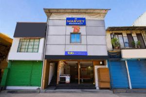 a building with a sign that reads the mannery warehouse at FabHotel Marvey Residency in Mumbai