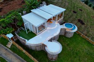 an aerial view of a house with a pool at ดอกฟ้า ม่อนแจ่ม in Mon Jam