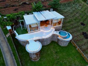 an aerial view of a house with a water slide at ดอกฟ้า ม่อนแจ่ม in Mon Jam +41 photos