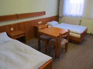 
Ein Bett oder Betten in einem Zimmer der Unterkunft Gasthof zum Galik
