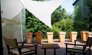a group of chairs and tables on a patio at Hotel President in Zagreb