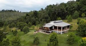 an aerial view of a house in the middle of a field at DuriDuri Eco Resort in Bentong