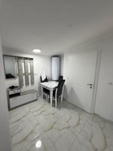 a white room with a table and a chair in it at Panorama Helshan Hotel in Helshan +15 photos