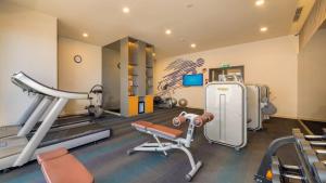 a room with a gym with a treadmill and equipment at Luxury Sea View Apartment in Nha Trang