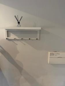 a white table sitting on top of a white wall at The Parade, Market Square room 3 in Northampton