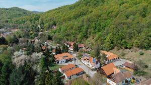 an aerial view of a small village in the mountains at Kiskörtés Vendégház Óhuta in Háromhuta