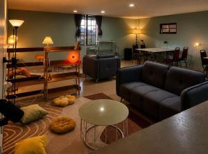 a living room with a couch and a table at Tekoma Hotel & Hostel Cameron Highlands - FREE SHUTTLE SERVICE in Tanah Rata