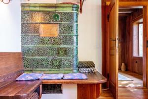 a wooden bench in a room with a stone wall at Kleines Waldglück in Lenzkirch +31 photos