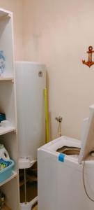 a kitchen with a white refrigerator in a room at Marmande in Marmande +23 photos