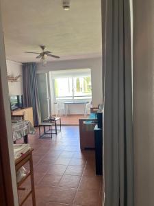 a living room with a couch and a table at APPARTEMENT sognu di rena G1 in San-Nicolao +8 photos