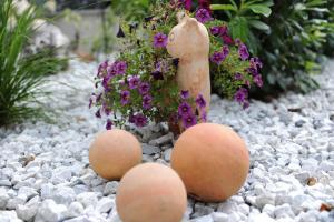 three eggs are sitting on a pebble ground at Appartements Agnes in Fulpmes