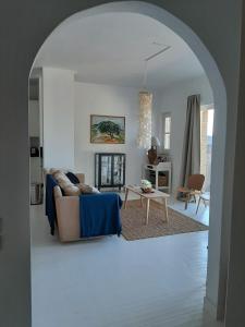 a living room with a couch and a table at Guesthouse Cato in Vátos