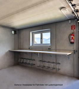 a window in a train room with a shelf at Der Burgblick-Adults Only 24 H Self Check In in Werfen