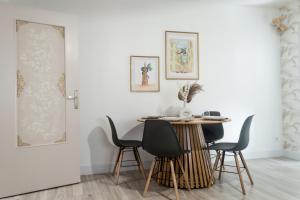 a dining room with a table and chairs at The Graoully's Cave - Hyper Centre in Metz