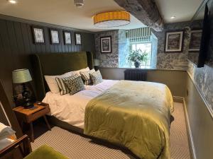 a bedroom with a large bed in a room at The Unicorn, Ambleside in Ambleside