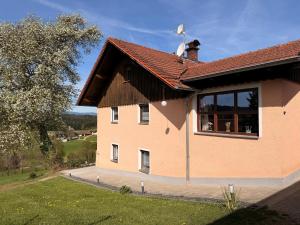 a house with a flag on top of it at Ferienhof Hofmann in Böbrach