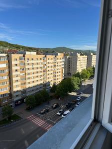 a view from a window of a parking lot at Perla Central Apartment in Zalău