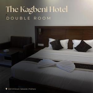 a hotel room with a bed with a bow tie on it at The Kagbeni Hotel in Pokhara