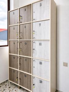 a locker room with lockers with numbers on it at Smash Hostel Batumi in Batumi