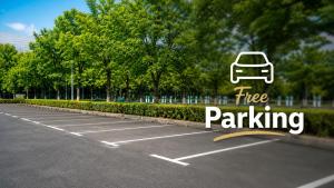 a parking lot with a car parked in it at Basic Work Stay Rooms - Highspeed WiFi - Easy Self Check-In - Practical and Affordable Stay in Bürs