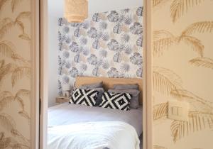 a bedroom with a bed with a wall at The Graoully's Cave - Hyper Centre in Metz +12 photos