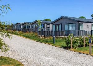 a row of houses on the side of a road at Penmarlam Lodge Retreat in Fowey