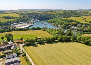 an aerial view of a river and a town at Penmarlam Lodge Retreat in Fowey
