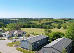 an aerial view of a house and a farm at Penmarlam Lodge Retreat in Fowey