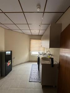 a kitchen with a sink and a counter in a room at Iraq palace apartment in As Sulaymānīyah