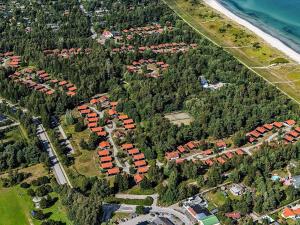 an aerial view of a group of houses and trees at 6 person holiday home in Væggerløse in Bøtø By