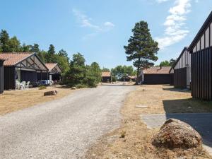 an empty road in front of a building at 6 person holiday home in Væggerløse in Bøtø By