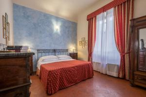 a bedroom with a bed and a large window at B&B Home in Florence in Florence