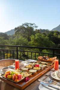 a table full of food on top of a table at AARAWILD Luxury Villas - Sigiriya in Sigiriya