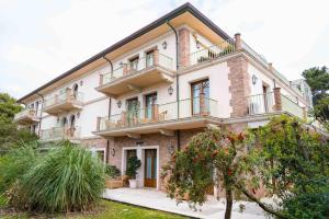 a large building with balconies on top of it at Park Hotel Villa Ariston in Lido di Camaiore +89 photos