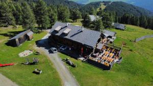an aerial view of a building on a hill at Branntweineralm in Tamsweg