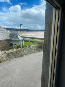 a view of the beach from a window at Station Hotel in Burghead